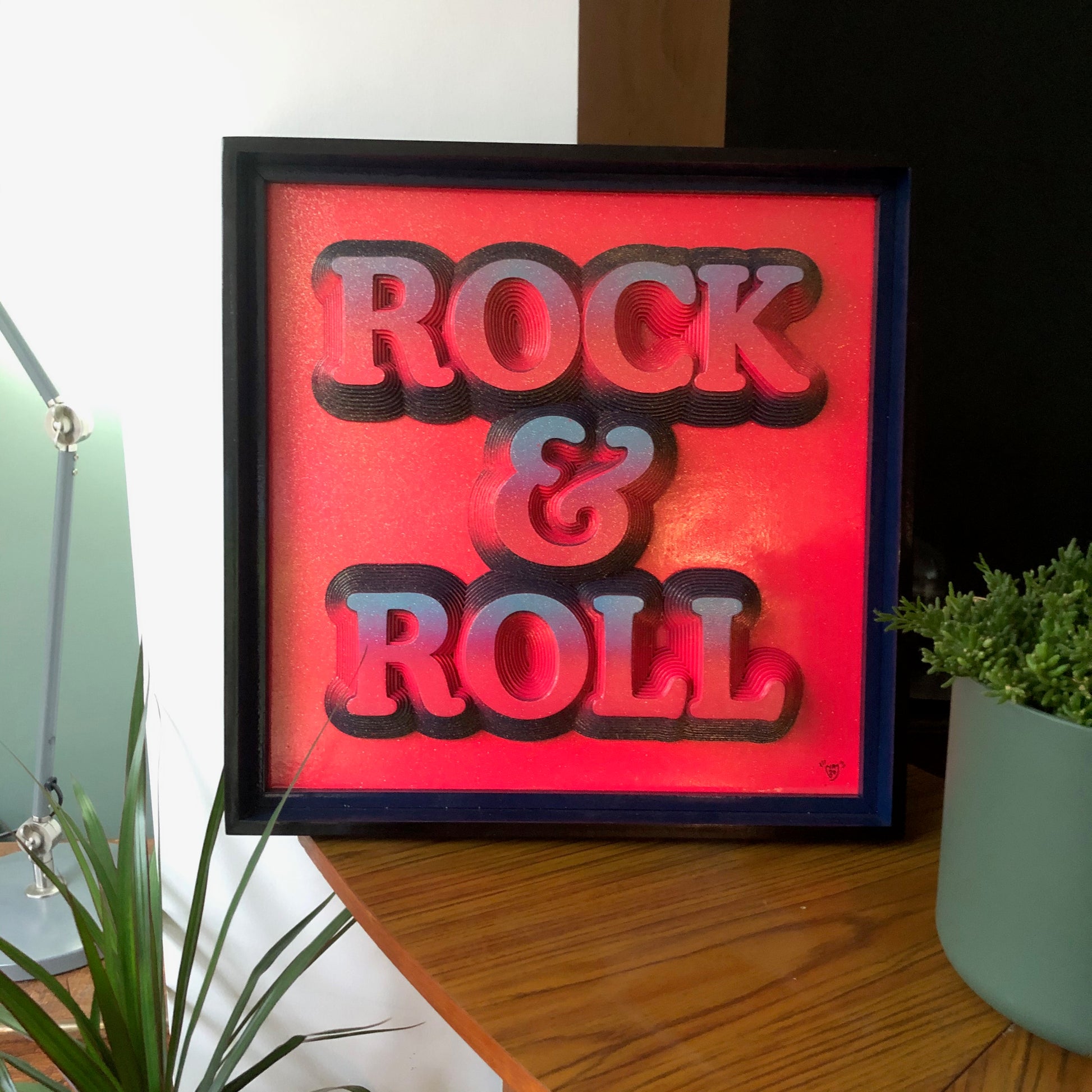 Multiple layered laser cuts finished in hot pink and glitter with a glossy varnish. Built in to a hand made box frame in complimentary colours. pop art cooper font rock and roll maximalist artwork wallart