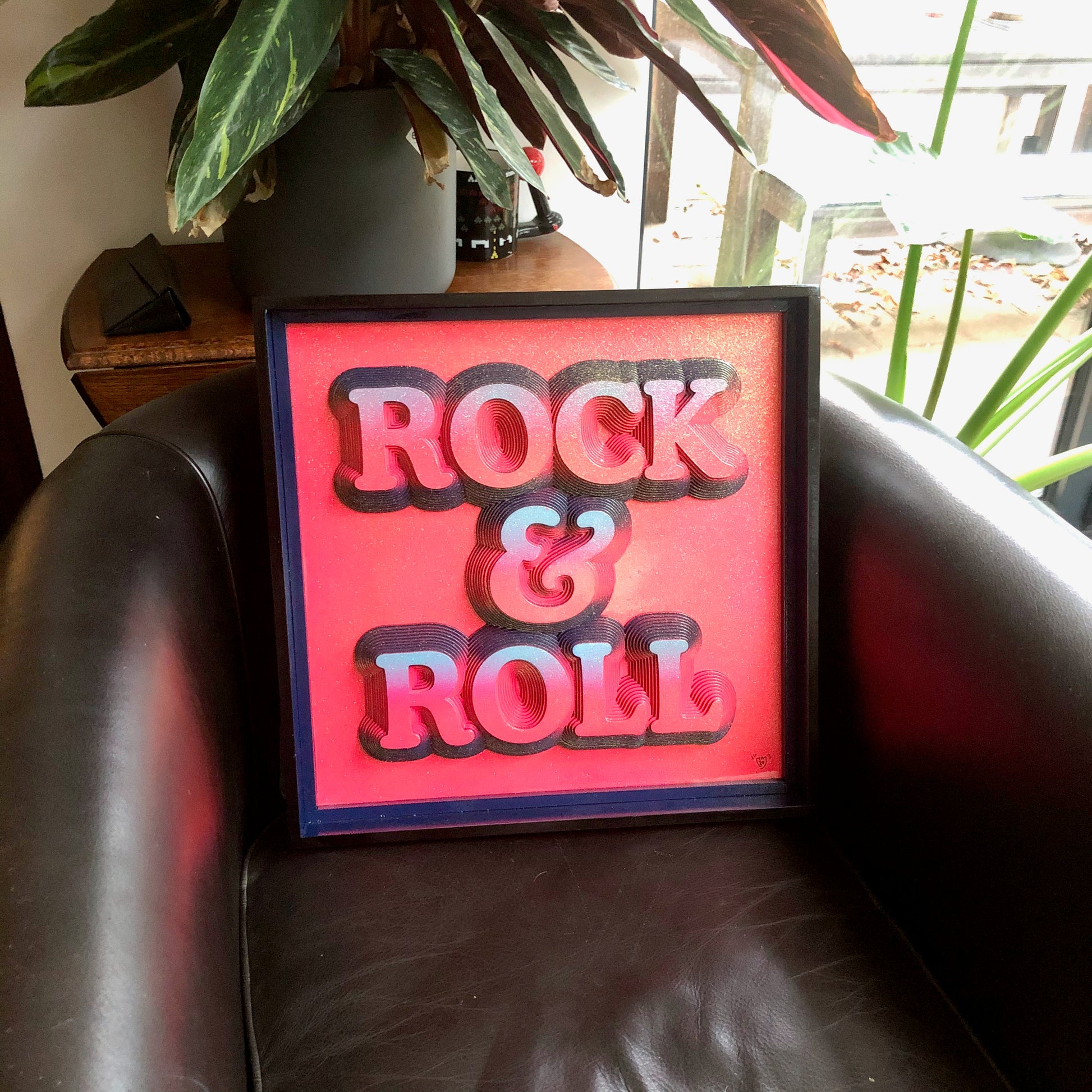 Multiple layered laser cuts finished in hot pink and glitter with a glossy varnish. Built in to a hand made box frame in complimentary colours. pop art cooper font rock and roll maximalist artwork wallart
