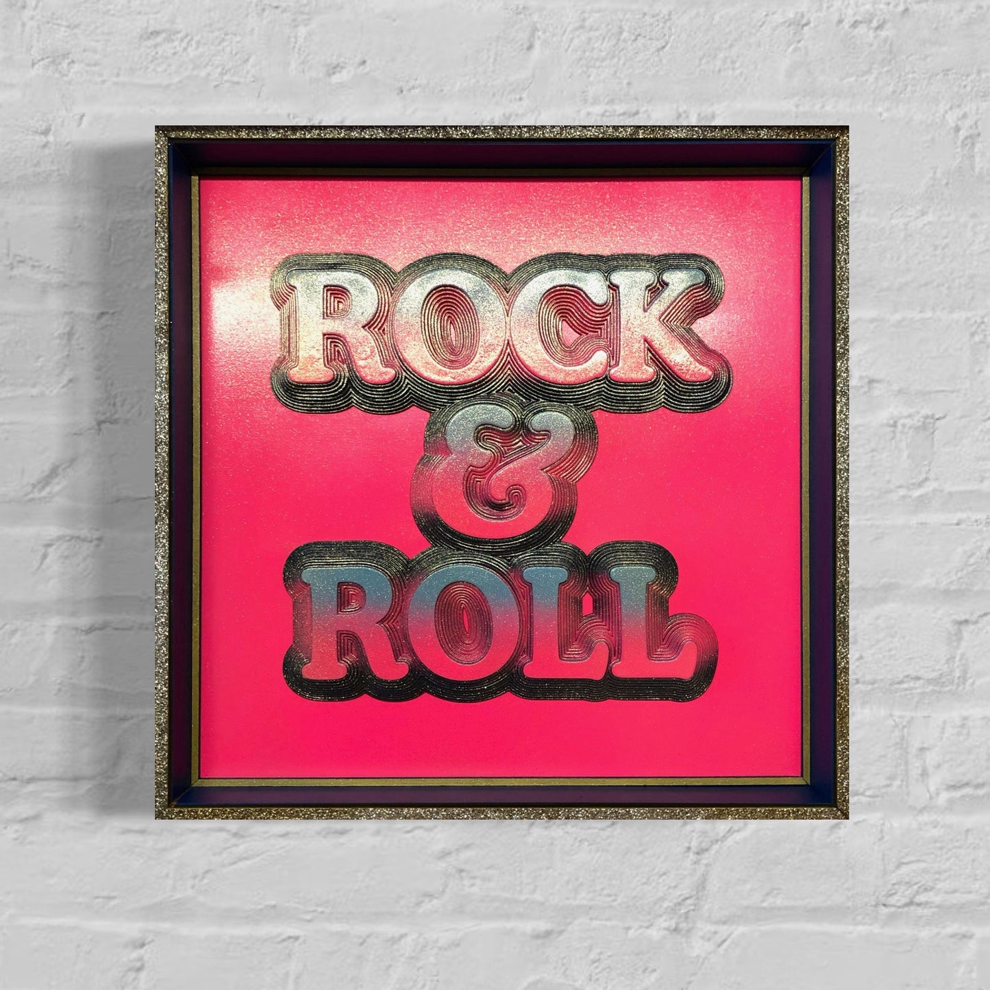Multiple layered laser cuts finished in hot pink and glitter with a glossy varnish. Built in to a hand made box frame in complimentary colours. pop art cooper font rock and roll maximalist artwork wallart