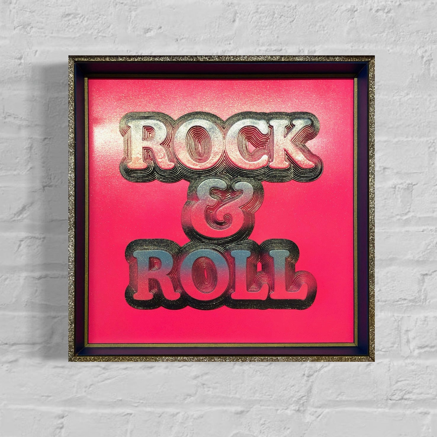 Multiple layered laser cuts finished in hot pink and glitter with a glossy varnish. Built in to a hand made box frame in complimentary colours. pop art cooper font rock and roll maximalist artwork wallart
